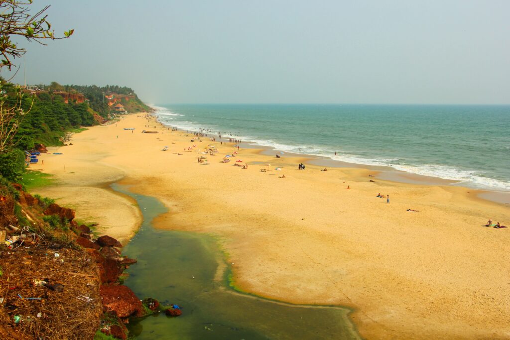 Body Ayurvedic Massage in Varkala Kerala 3 A breathtaking aerial view of Varkala Beach in Kerala, India with golden sands and tranquil waves.
